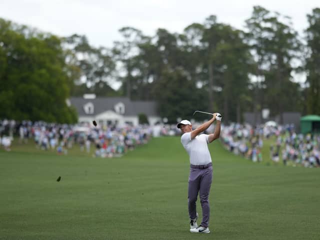 Rory McIlroy hits from the fairway on the first hole during the first round at the Masters golf tournament at Augusta National Golf Club