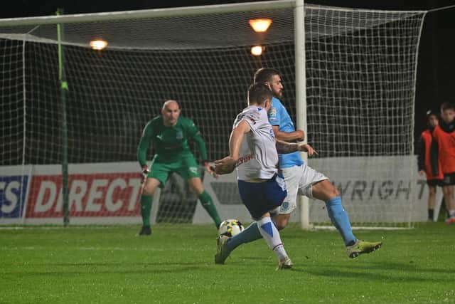 Linfield’s Chris McKee scores the winning goal against Ballymena United. PIC: Colm Lenaghan/Pacemaker