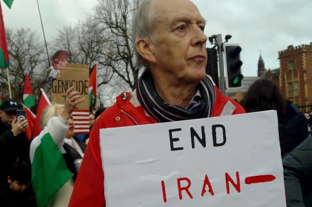 Liam Kennedy, holding a sign that reads 'End Iran-Hamas collusion' last weekend at pro Palestinian rally in Belfast, says the 600 Irish academics who in a letter to the Irish Times called for a boycott of Israeli universities have done themselves a disservice