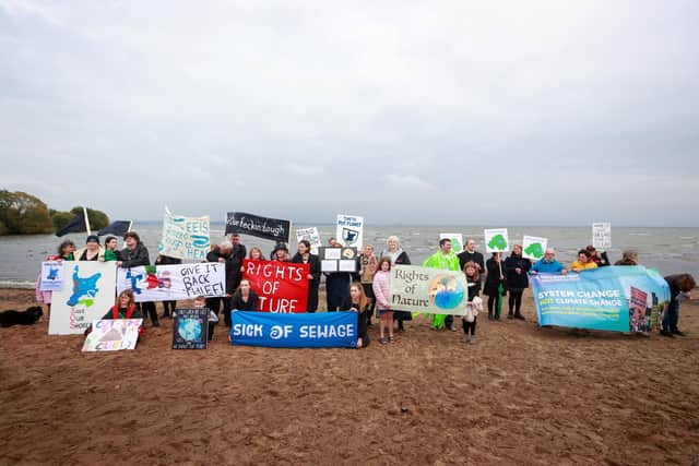 Environmental campaigners hold a "wake" at Ballyronan beach for Lough Neagh lake amid claims toxic algae is killing the UK and Ireland's largest freshwater lake. Photo: Liam McBurney/PA Wire