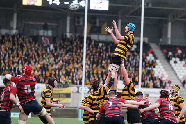 RBAI’s Milo Carter is lifted into the air as he fights for possession