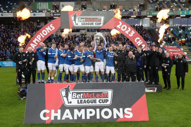 Linfield players celebrate with the cup