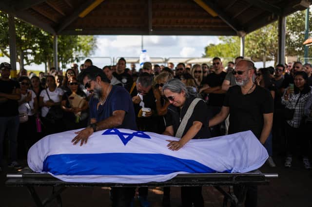 Relatives mourn during the funeral on Sunday of Antonio Macias, killed by Hamas militants while attending a music festival in southern Israel on October 7.  Israel is up against an army of unadulterated evil that is encouraged and helped by rogue nations like Iran and Russia, writes Ruth Dudley Edwards