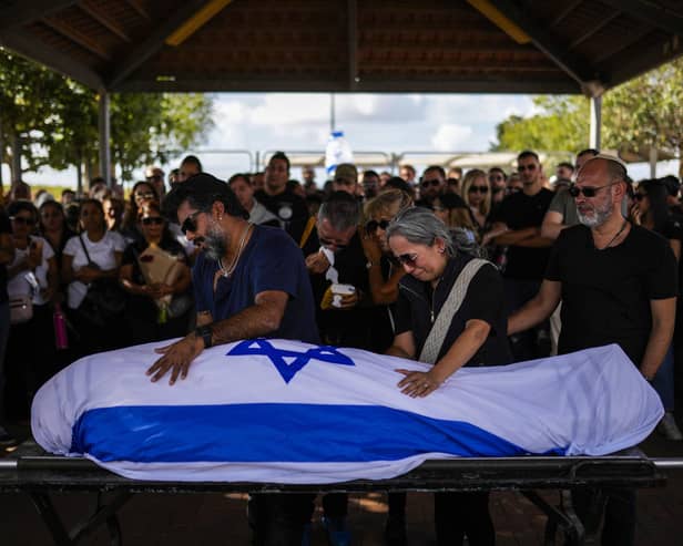 Relatives mourn during the funeral on Sunday of Antonio Macias, killed by Hamas militants while attending a music festival in southern Israel on October 7.  Israel is up against an army of unadulterated evil that is encouraged and helped by rogue nations like Iran and Russia, writes Ruth Dudley Edwards