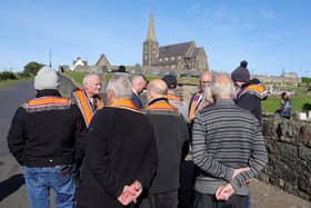 Orangemen pictured at Drumcree Parish Church on Monday as the stand-off continues (picture by Jonathan Porter/PressEye)