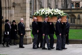 The coffin of Sir Bobby Charlton is carried by pallbearers out of Manchester Cathedral after the funeral service. Manchester United and England great Sir Bobby Charlton died aged 86 in October. (Photo by Martin Rickett/PA Wire)