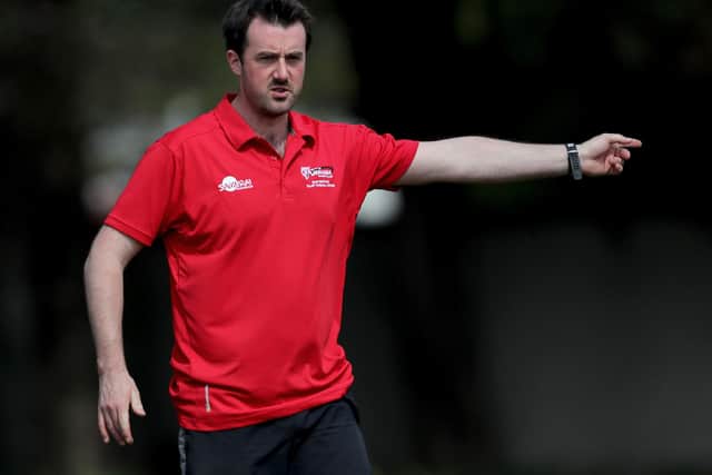 Chris Parker's Armagh hold a slender one-point lead at the top of AIL Division 1B with four games left.