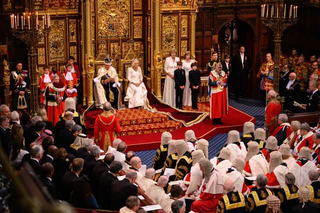 King Charles delivers a speech, setting out the government’s plan, beside Queen Camilla at yesterday’s State Opening of Parliament in the House of Lords. Photo: Leon Neal/PA Wire