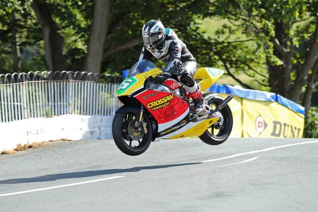 Michael Dunlop on the Honda RS250 in the Crossan Motorcycles livery at Ballaugh Bridge during practice at the Manx Grand Prix on Sunday.