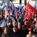 Public sector workers walk from the picket line at the Royal Victoria Hospital to a rally at Belfast City Hall, as an estimated 150,000 workers take part in walkouts over pay across Northern Ireland.