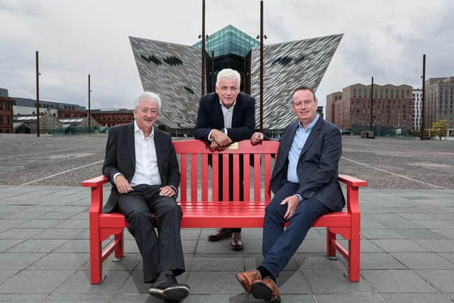 Manufacturing NI chief executive Stephen Kelly and former Tourism NI chief executive John McGrillen share their heart journey on an iconic BHF red bench at Titanic Belfast with head of BHF NI Fearghal McKinney