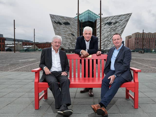 Manufacturing NI chief executive Stephen Kelly and former Tourism NI chief executive John McGrillen share their heart journey on an iconic BHF red bench at Titanic Belfast with head of BHF NI Fearghal McKinney