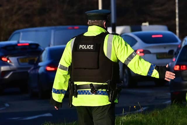 PSNI officers conducting vehicle checks. Photo: Colm Lenaghan/Pacemaker