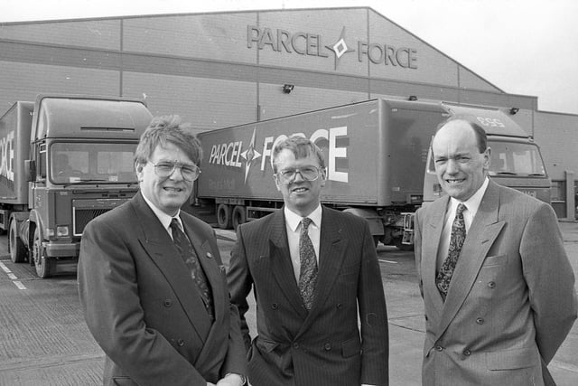 Parcel Force director Jim Woodman, centre, opens the new sorting centre at Belfast Harbour Industrial Estate, at the end of February 1992, with Jim Prentice, area operations manager for Northern Ireland and Scotland, left, and another unnamed colleague. Picture: News Letter archives