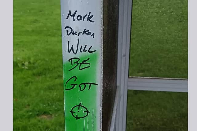 In a Facebook post, Mr Durkan posted a photograph of graffiti on a bus shelter which read “Mark Durkan will be got” alongside an image of a crosshair