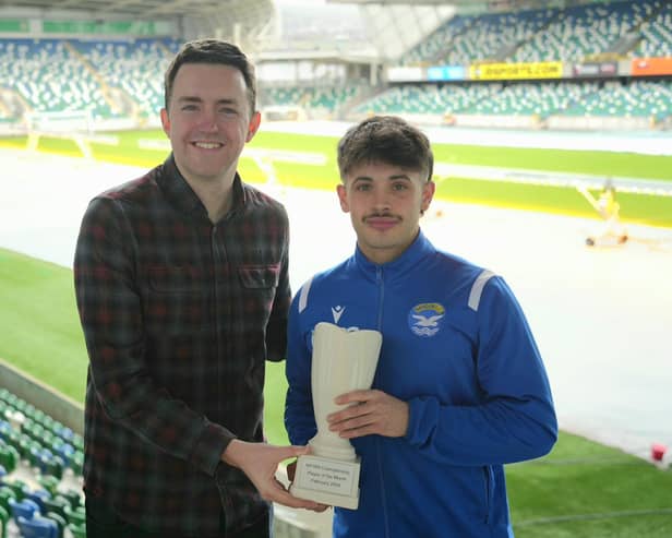 NIFWA Chairman Michael Clarke presents Bangor's Scott McArthur with his Championship Player of the Month award