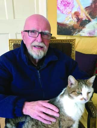 Herbie relaxing at his home in Carlow with his cat