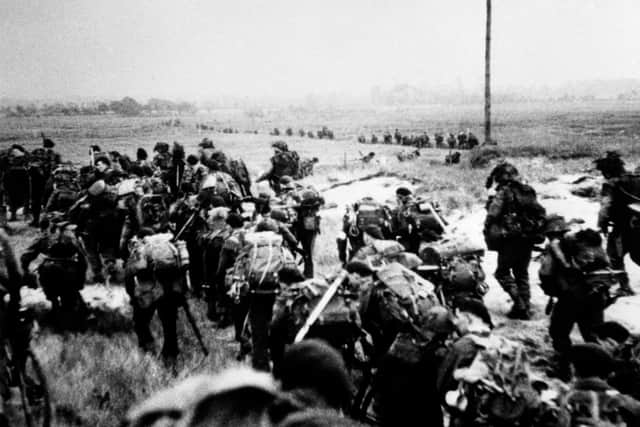 British soldiers moving off the Normandy Beaches on D-Day during the advance inland from ‘Sword’ beach, where Royal Ulster Rifles soldiers such as Stanley Burrows landed. Photo: PA Wire