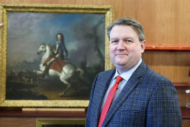 Bloomfield Auctions managing director Karl Bennett with a17th century portrait of King William III  that is being sold by the auction house