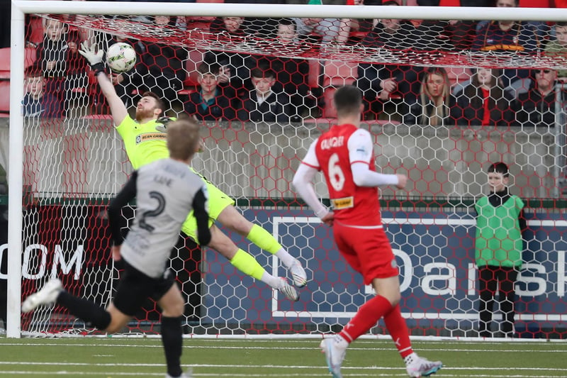 Cliftonville goalkeeper Nathan Gartside can't stop Lyndon Kane from opening the scoring for Coleraine at Solitude