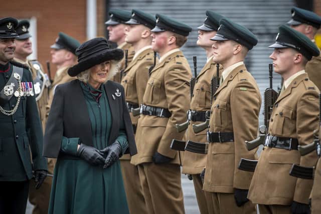 Queen Camilla inspecting the riflemen during a parade at Thiepval Barracks in Lisburn, County Antrim, alongside Lieutenant Colonel Dan Brown, signifying soldiers who have finished a junior leadership selection course. PA Photo.