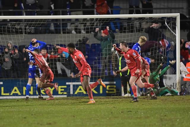 Benny Ighiehon wheels away in celebration after his goal secured a 4-3 victory for Portadown against Newry City