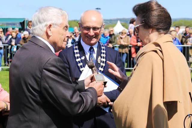 Terence McKeag (left) cracking a joke with Princess Anne.