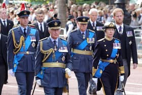 Prince William, Prince of Wales, King Charles III, Prince Richard, Duke of Gloucester, Anne, Princess Royal and Prince Harry, Duke of Sussex walk behind the coffin during the procession for the Lying-in State of Queen Elizabeth II