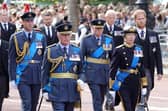 Prince William, Prince of Wales, King Charles III, Prince Richard, Duke of Gloucester, Anne, Princess Royal and Prince Harry, Duke of Sussex walk behind the coffin during the procession for the Lying-in State of Queen Elizabeth II