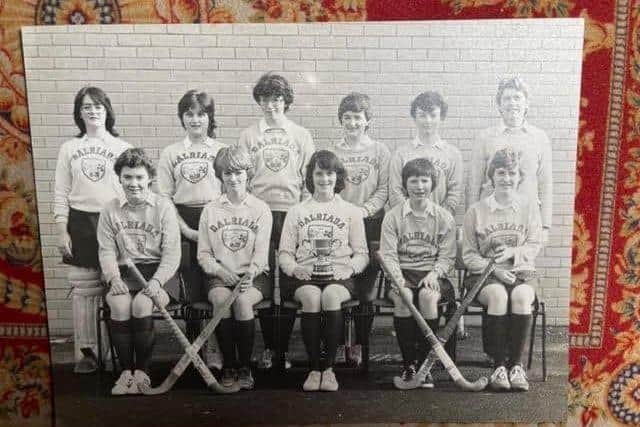 The album features several pictures of girls' hockey teams (some are labelled with late 1970’s and early 1980’s dates). In a couple of the photos, the girls are wearing Dalriada shirts