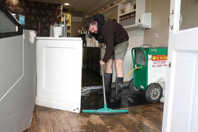 Michael Nugent cleans up his ice cream shop in Newry after flooding. Photo by Jonathan Porter / Press Eye.