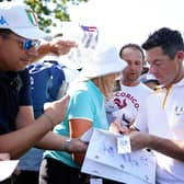 Team Europe's Rory McIlroy signs autographs for fans at the Marco Simone Golf and Country Club in Rome ahead of the Ryder Cup. (Photo by Zac Goodwin/PA Wire)