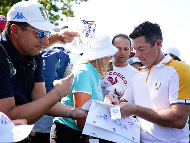 Team Europe's Rory McIlroy signs autographs for fans at the Marco Simone Golf and Country Club in Rome ahead of the Ryder Cup. (Photo by Zac Goodwin/PA Wire)