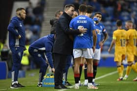 Rangers manager Michael Beale speaks to Cyriel Dessers during a Viaplay Cup Quarter-final match between Rangers and Livingston at Ibrox