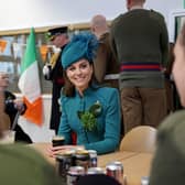 The Princess of Wales meets members of the Irish Guards and enjoys a glass of Guinness during a visit to the 1st Battalion Irish Guards for the St Patrick's Day Parade, at Mons Barracks in Aldershot.