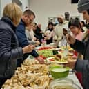 A Middle Eastern style meal is held on Sunday December 3 2023 at St Patrick's Parish Church of Ireland, Drumbeg after it hosted an Advent Carol service for migrants, asylum seekers and people newly arrived in Northern Ireland