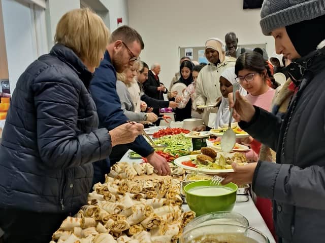 A Middle Eastern style meal is held on Sunday December 3 2023 at St Patrick's Parish Church of Ireland, Drumbeg after it hosted an Advent Carol service for migrants, asylum seekers and people newly arrived in Northern Ireland