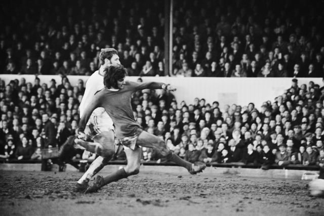 Manchester United player George Best scores during a match against Northampton Town, UK, 7th February 1970.  (Photo by Joe Bangay/Daily Express/Getty Images)