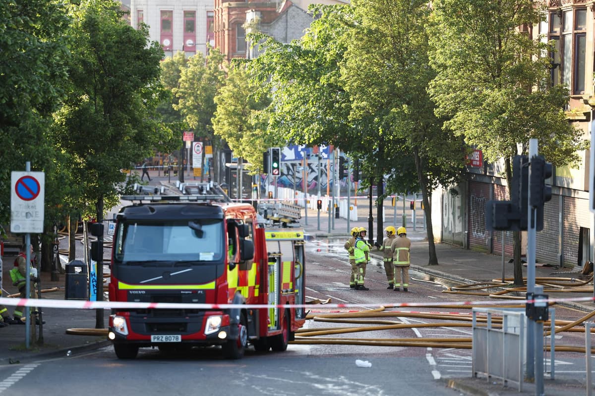 Roads in Belfast city centre closed as fire fighters tackle large blaze at derelict building