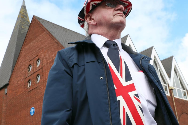 PACEMAKER, BELFAST, 13/7/2020: Jim Taggart sports a Union Jack hat and tie as he watches the bands parade on the Shankill Road, Belfas