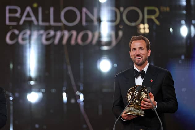 England and Bayern Munich forward Harry Kane reacts after receiving the Ballon d'Or award. (Photo by FRANCK FIFE / AFP via Getty Images)