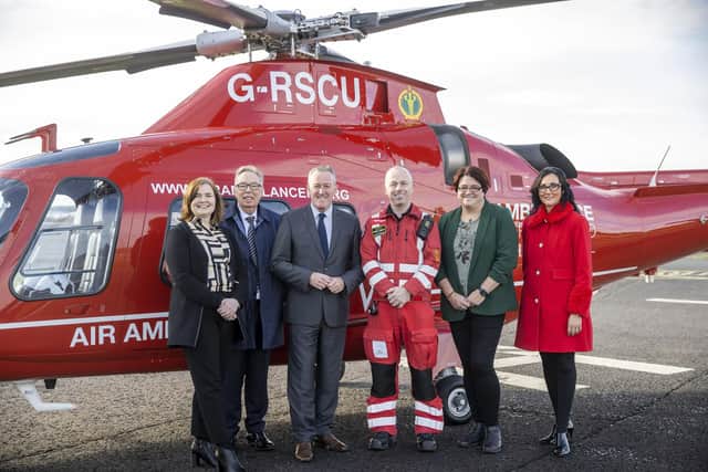 (Left-right) Breige Mulholland, Head of Finance and Chair Operations at Air Ambulance NI, Dr Gerard O'Hare, Chairman of Air Ambulance NI, Finance Minister Conor Murphy, Glenn O'Rorke Operation Lead at HEMS, Kate Beggs NI Director of The National Lottery Community Fund, and Kerry Anderson Head of Fundraising at Air Ambulance NI, during a Ministerial visit to Air Ambulance Northern Ireland in Lisburn. Photo: Liam McBurney/PA Wire