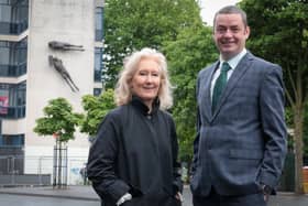 Anne Stewart, Senior Curator of Art at National Museums NI, at the works before their removal today with John Ferris, Regional Board Member, Ulster Bank.