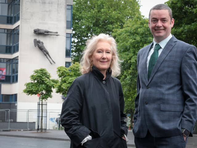 Anne Stewart, Senior Curator of Art at National Museums NI, at the works before their removal today with John Ferris, Regional Board Member, Ulster Bank.