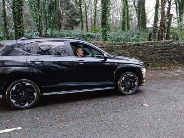 This woman was unsure whether to drive through the flooding because her car was electric, and seeing that the News Letter was filming the scene she asked if it was safe to travel on. Pic Ben Lowry on Saturday January 17 2026