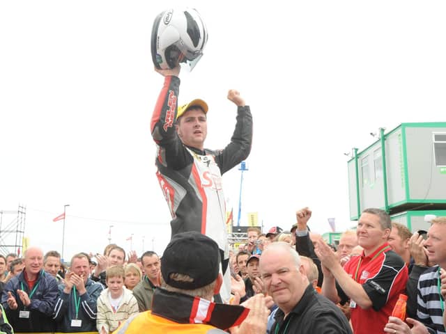 Michael Dunlop is hoisted aloft after winning an emotional 250cc race at the North West 200 in 2008 less than 48 hours after his father Robert was killed in a crash at the event