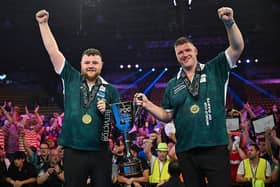 FRANKFURT AM MAIN, GERMANY - JUNE 15: Josh Rock of Northern Ireland celebrates with Daryl Gurney of Northern Ireland with the Trophy after victory in their final match on day four of BetVictor World Cup of Darts 2025 at Eissporthalle Frankfurt on June 15, 2025 in Frankfurt am Main, Germany. (Photo by Florian Wiegand/Getty Images)