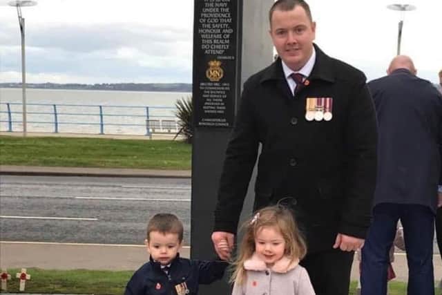 Former Irish Guard Bryan Phillips on a previous Remembrance Sunday with children Archie and Poppy
