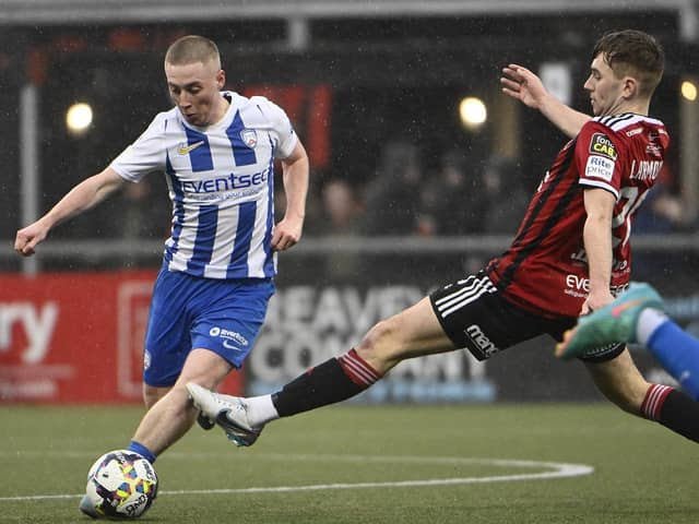 Coleraine winger Conor McKendry pictured with Crusaders defender Daniel Larmour at Seaview