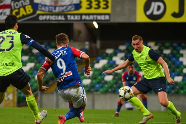 Linfield's Joel Cooper with the finishing touch to a fine solo run against Glenavon at Windsor Park. (Photo by Andrew McCarroll/Pacemaker)
